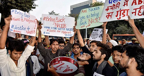 AMU and JNU students holding a protest over missing student Najeeb outside Delhi Police headquarters. | PTI