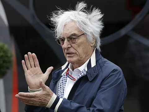In this file photo dated Saturday, July 9, 2016, Bernie Ecclestone gestures in a paddock at the Silverstone racetrack, Silverstone, England. | AP
