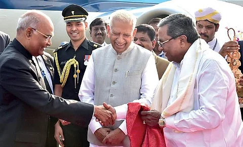 (From right) Chief Minister Siddaramaiah and Governor Vajubhai Vala receiving President Ram Nath Kovind at HAL airport in Bengaluru on Tuesday | Express