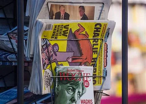 Copies of the French satirical magazine Charlie Hebdo sit at a newsagent's in Stuttgart, Germany. (AP)