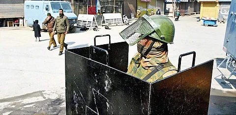 A CRPF jawan guards an area from behind a bullet-proof shield. (File | PTI)