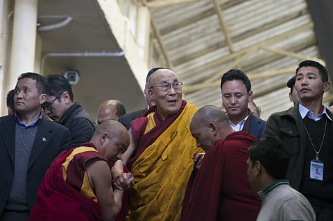 Tibetan spiritual leader the Dalai Lama, in yellow robe, leaves after giving a religious talk at the Tsuglakhang temple, Dharmsala, India, March 14, 2017. (Photo | AP)