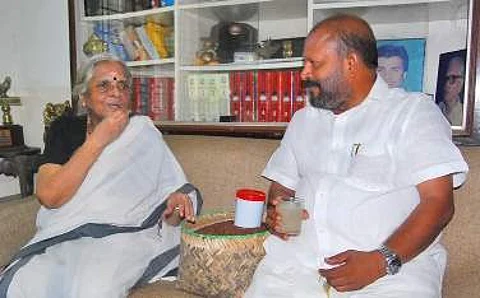 Poet Sugathakumari was presented with rice harvested from the fields where the Aranmula Airport project was to come up Manu R Mavelil