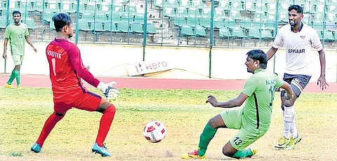Action from the match between Madras Sporting Union and Southern Railway; | D SAMPATHKUMAR