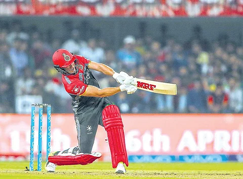 Royal Challengers Bangalore’s AB de Villiers takes the aerial route against Kings XI Punjab on Monday | BCCI