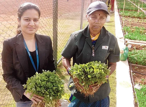 Nidhi Singh with a worker