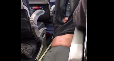Smartphone video posted online showed three Chicago Department of Aviation police officers struggling with a seated middle-aged man. | Picture Courtesy: @janene1102