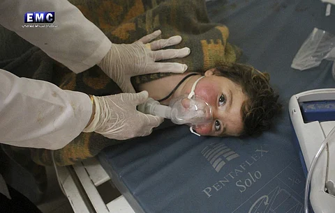 A doctor treating a child following a suspected chemical attack, at a makeshift hospital, in the town of Khan Sheikhoun, northern Idlib province, Syria. (Photo | AP)