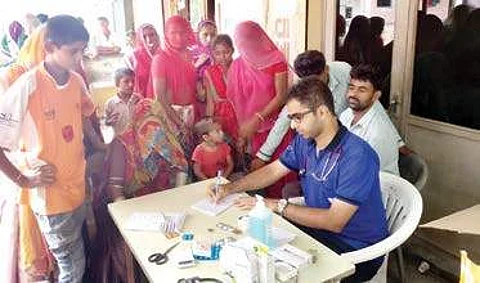 Dr Edmond Fernandes at a health camp organised in a flood-hit village in Banaskantha district, Gujarat