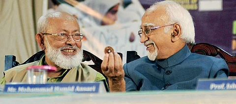 Former Vice-President Mohammad Hamid Ansari sharing a light moment with Institute of Objective Studies chairman M Mansoor Alam during the international conference on 'The role of woman in making a humane society' in Kozhikode on Saturday | A Sanesh