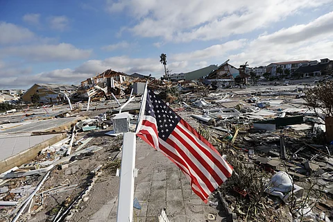 An American flag flies amidst destruction in the aftermath of Hurricane Michael in Mexico Beach, Fla., Thursday, Oct. 11, 2018. (Photo | AP)