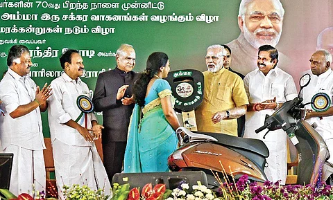 Prime Minister Narendra Modi launches the Amma Two-Wheeler Scheme in the presence of Tamil Nadu Governor Banwarilal Purohit (centre) and Chief Minister Edappadi K Palaniswami in Chennai on Saturday | P Jawahar