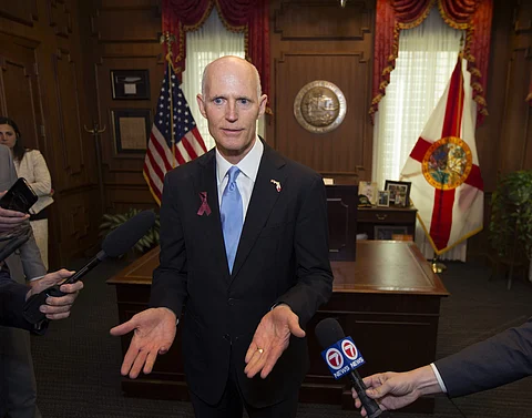 Florida Gov. Rick Scott talks to the media in his office after signing the Marjory Stoneman Douglas Public Safety Act at the Florida Capital in Tallahassee, Fla., Friday, March 9, 2018. (Associated Press)