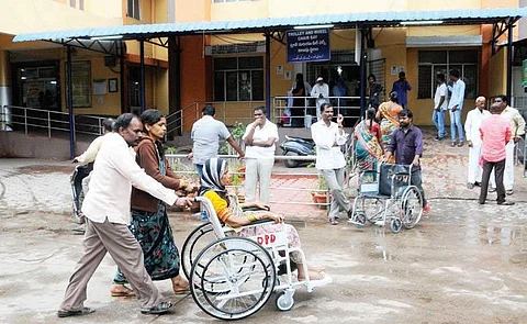 A patient being taken on a wheelchair to Gandhi Hospital’s ICU