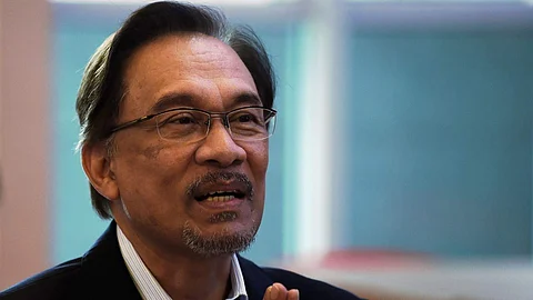 Selfies with his captors: A whirlwind day for Malaysia's reformist Anwar Ibrahim