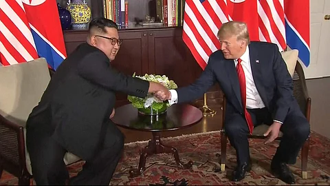 U.S. President Donald Trump and North Korean leader Kim Jong Un shake hands ahead of their meeting at Capella Hotel in Singapore, Tuesday, June 12, 2018. (Photo | AP)