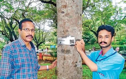 A Gangaprasad (left), assistant professor, department of botany, University of Kerala with Akhilesh S V Nair, who has undertaken the QR coding initiative