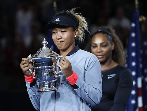 Naomi Osaka, of Japan, holds the trophy after defeating Serena Williams in the women's final of the U.S. Open tennis tournament, Saturday, Sept. 8, 2018, in New York. | AP