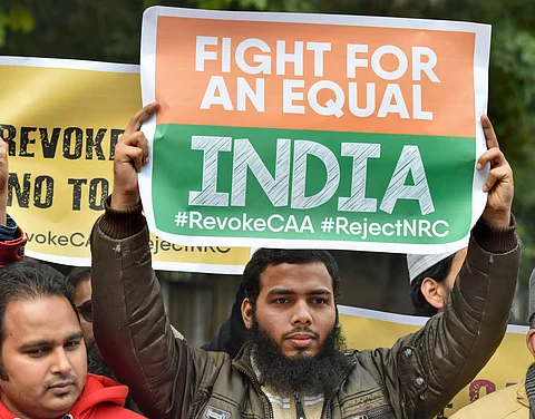 Activists hold placards during anti-Citizenship Act protest. (Photo| PTI)