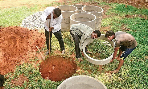 Well-diggers get busy with their work at Cubbon Park on Wednesday (Photo | Shriram B N/EPS