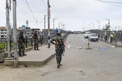 Security personnel stand guard during restrictions in Srinagar Thursday August 8 2019. | PTI