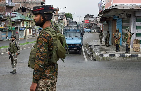 Security personnel stand guard during curfew like restriction on fifth consecutive day in Srinagar Friday August 9 2019. | PTI