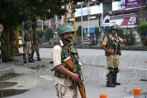 Security personnel stand guard in a street on the seventh day of curfew in Srinagar Sunday August 11, 2019. | PTI