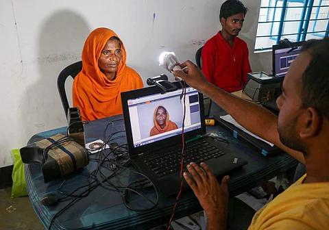 An official takes photo of an applicant to submit her bio-metrics data ahead of NRC final draft publication at Hatipara village in Kamrup Friday August 30 2019. | PTI