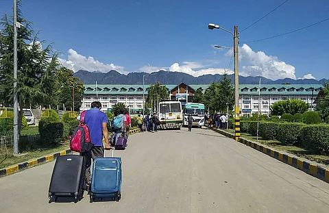 Non- local NIT students wait for vehicle as they leave from valley after government issued security advisory. J&K administration has issued directions to officials to facilitate the return of outside students to their states. (Photo  | PTI)