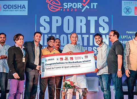 CM Naveen Patnaik felicitating winners of Hackathon contest during valedictory ceremony of SPORT IT 2020 at Kalinga Stadium in Bhubaneswar. (Photo | EPS)