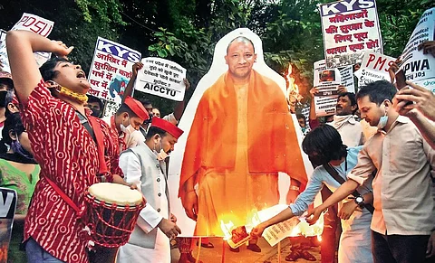 Demonstrators burn a cut-out of UP CM Yogi Adityanath at Jantar Mantar during a protest demanding justice for the victim of Hathras gang-rape and murder victim. (Photo| Parveen Negi, EPS)