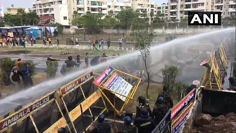 Farmers headed to Delhi to stage protest attempt to break through police barricades. (Photo| ANI)