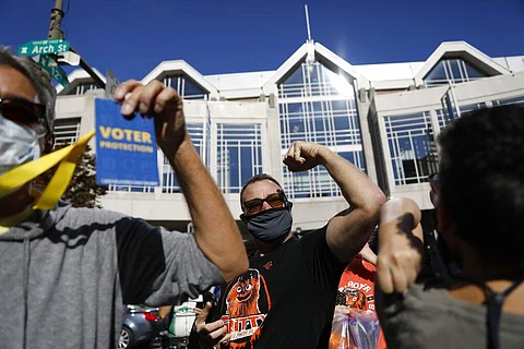 People celebrate outside the Pennsylvania Convention Center after Democrat Joe Biden defeated President Donald Trump. (Photo | AP)