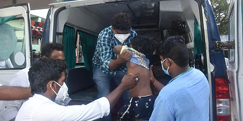 Medical staff shifting a boy who is suffering from mystery illness at government hospital in Eluru. (Photo| P Ravindra Babu, EPS)