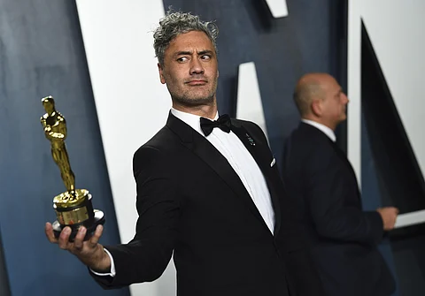 Taika Waititi, winner of the award for best adapted screenplay for 'Jojo Rabbit,' arrives at the Vanity Fair Oscar Party. (Photo | AP)
