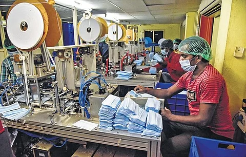 Workers at a surgical mask manufacturing unit in Hyderabad. | Vinay Madapu