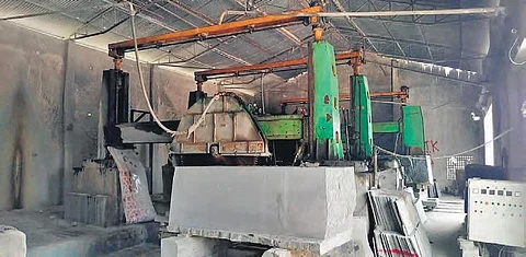 Machines at a granite factory lie idle in the absence of workers since the lockdown, in Khammam on Monday