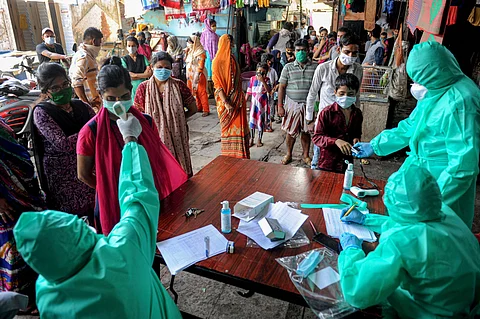 Medics conduct COVID-19 screening of Kumbharwada residents at a camp during the ongoing nationwide lockdown to curb the spread of coronavirus at Dharavi in Mumbai Friday May 29 2020. (Photo | PTI)
