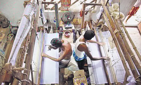 Members of Anakaputhur Jute Weavers Association at work. (Photo | EPS/R Satish Babu)