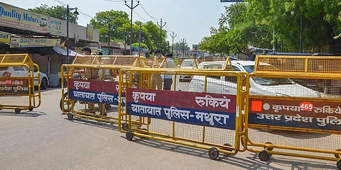 UP Police barricades put on a road to block the movement of people towards Hathras and Aligarh districts during a lockdown to curb the COVID-19 pandemic in Mathura. (Photo | PTI)