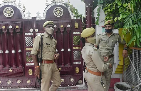 Police deployment at the residence of gangster Vikas Dubey's brother Deep Prakash in Krishna Nagar locality of Lucknow Friday July 10 2020. (Photo | PTI)