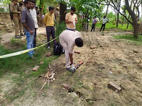 Kanpur Police and forensic team members investigate the encounter site where 8 police personnel lost their lives after being fired upon by criminals in Kanpur. (File Photo | PTI)