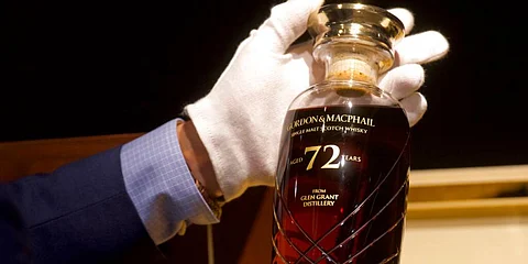 72-year-old bottle of Glen Grant single malt whisky from Scotland is displayed at a Bonhams auction preview in Hong Kong. (Photo | AP)