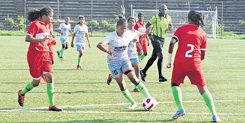 Players of CV Seena Academy (grey) and World Malayali Federation FC (red) s in action during the inaugural match of Khelo India U-17 women's league at Kochi in 2020. (File Photo)