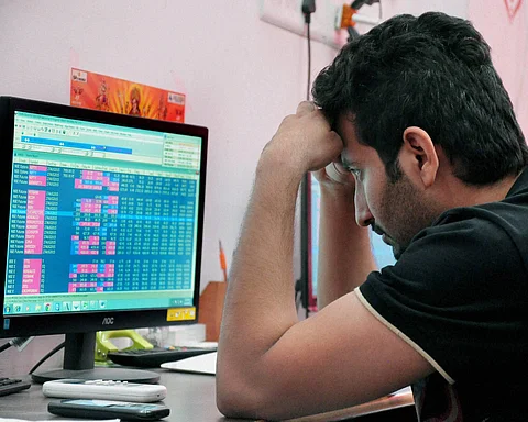 A broker reacts while watching the stock price changes (File Photo | PTI)
