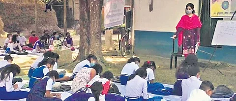 Students attend offline classes in the premises of a mosque in Jalpaiguri. (Photo | EXPRESS)