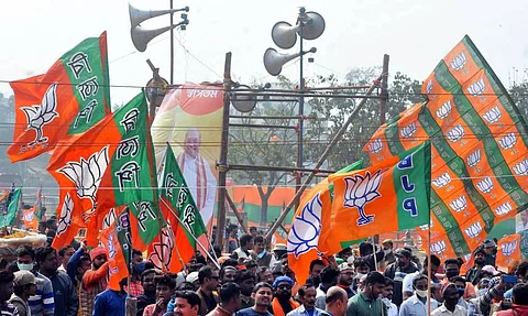 BJP workers gather during a public rally at Domurjala Stadium in Howrah district of West Bengal Sunday Jan. 31 2021. (Photo | PTI)