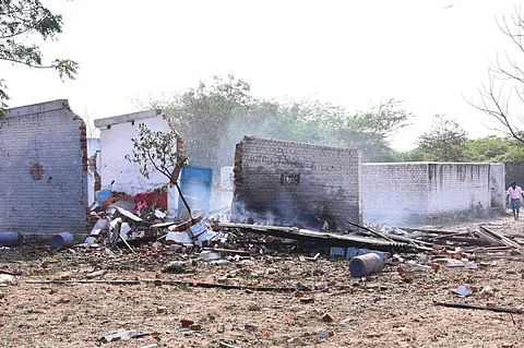 A view of the working sheds seen damaged following the blast that was triggered at a cracker unit at Achankulam  village near Sattur in Virudhunagar district. (Photo | EPS)