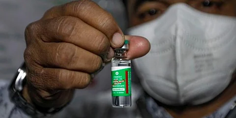 A health worker shows the Covishield vaccine (File photo | EPS)
