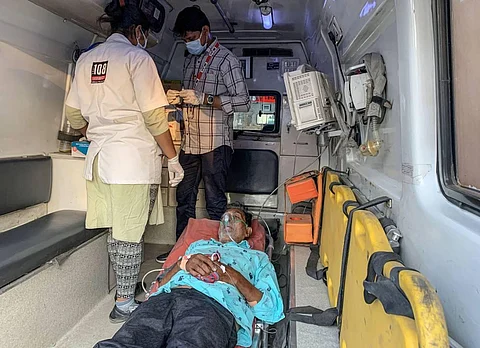 A COVID-19 patient receives primary treatment inside an ambulance at the COVID-19 OPD of the Government Civil Hospital, in Ahmedabad. (Photo | PTI)